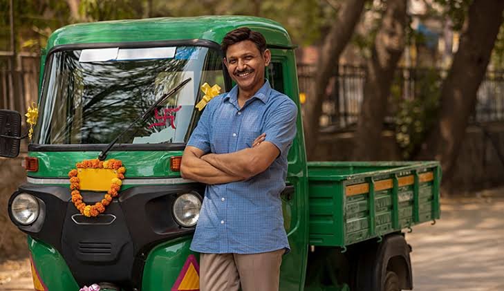Indian commercial vehicle owner reviewing CV loan financing